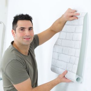 A Contractor Working on a Commercial Wall Covering Installation in Saugus, MA